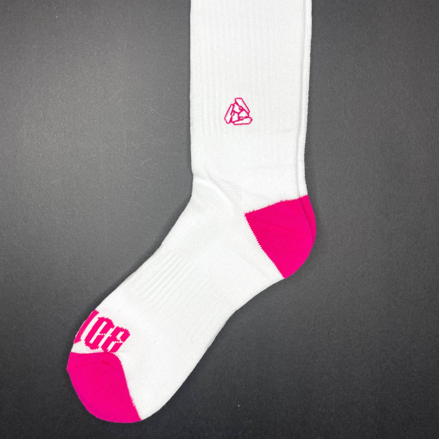 Side view of Menace Clothing Hood Rat pink and white knee high socks with Menace on toes and Tri M logo on side.
